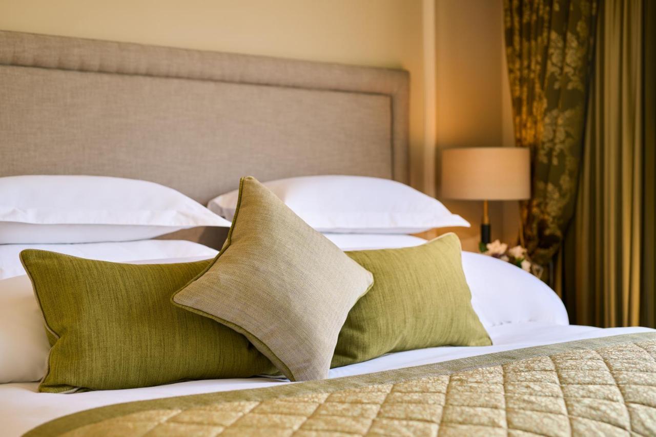 Castlemartyr Resort Hotel Exteriör bild A bed with cushions